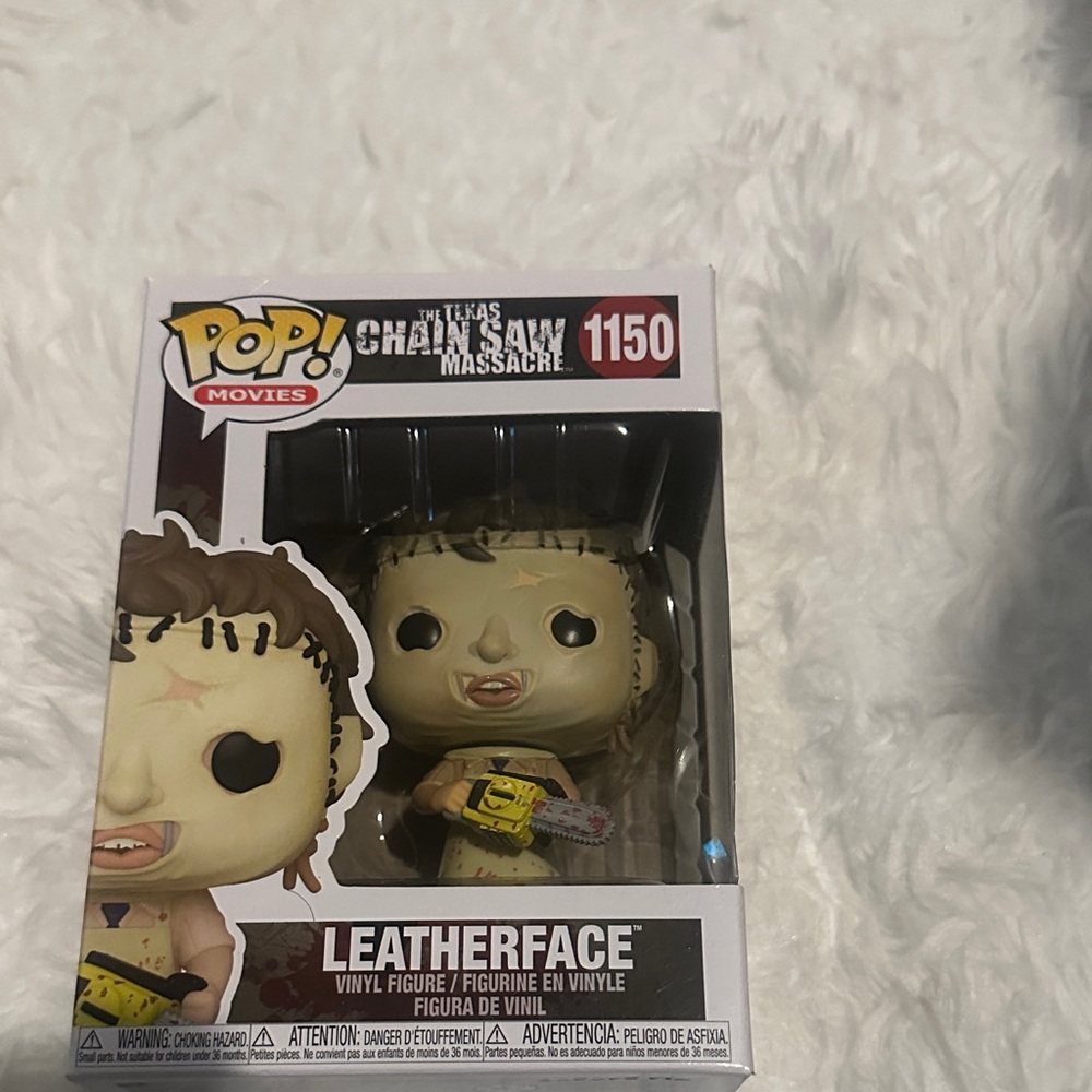 Funko Pop Leatherface Figure with Yellow and Gray Accents